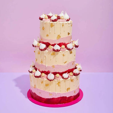 3 Tier Cake - Design Your Own with pink and cream frosting, decorated with meringue kisses and gold leaf accents.